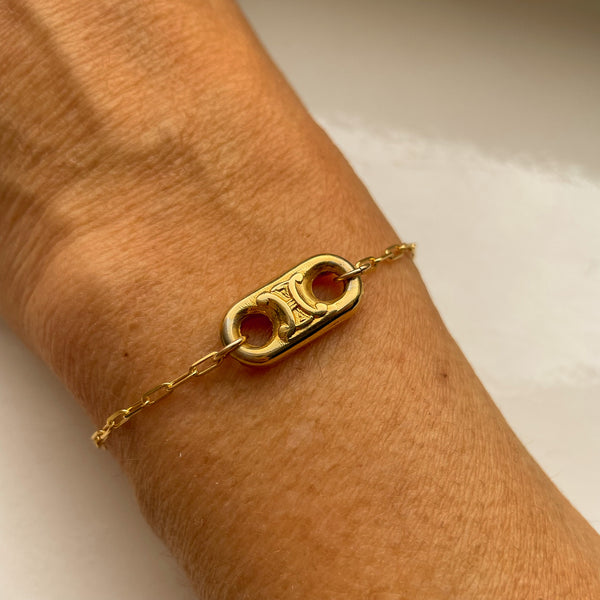 worn golden bracelet